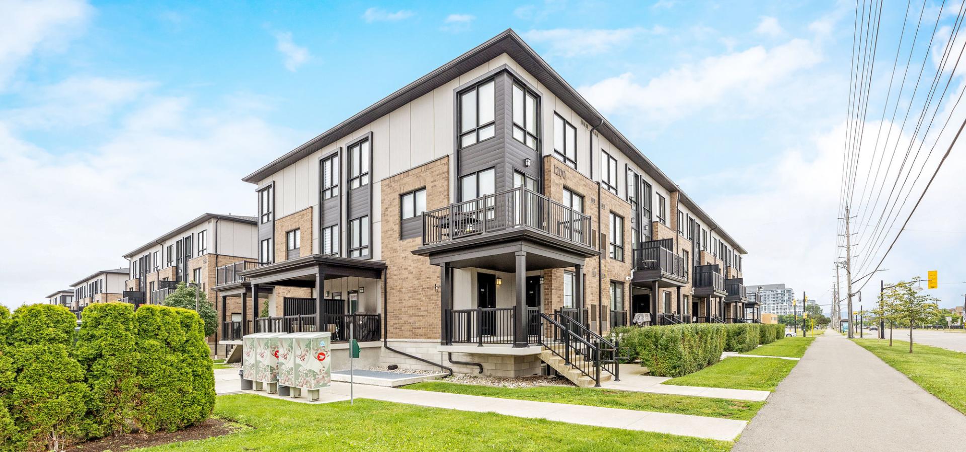 Modern brick and siding stacked townhouses